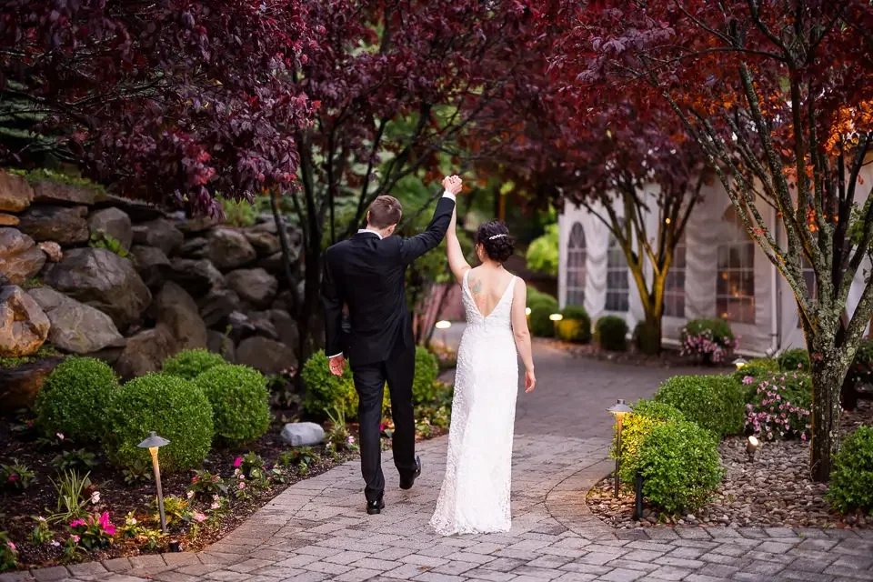 Newly married couple walking together after their ceremony, captured in a natural, candid moment
