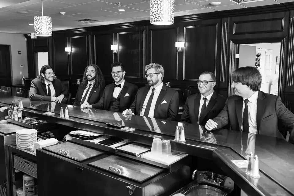 Groomsmen Relaxing Together Before Wedding Day