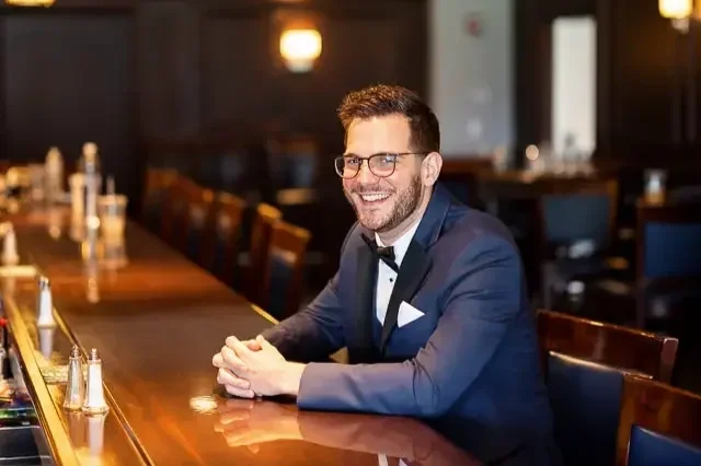 Groom Portrait at Bar Before Wedding Ceremony