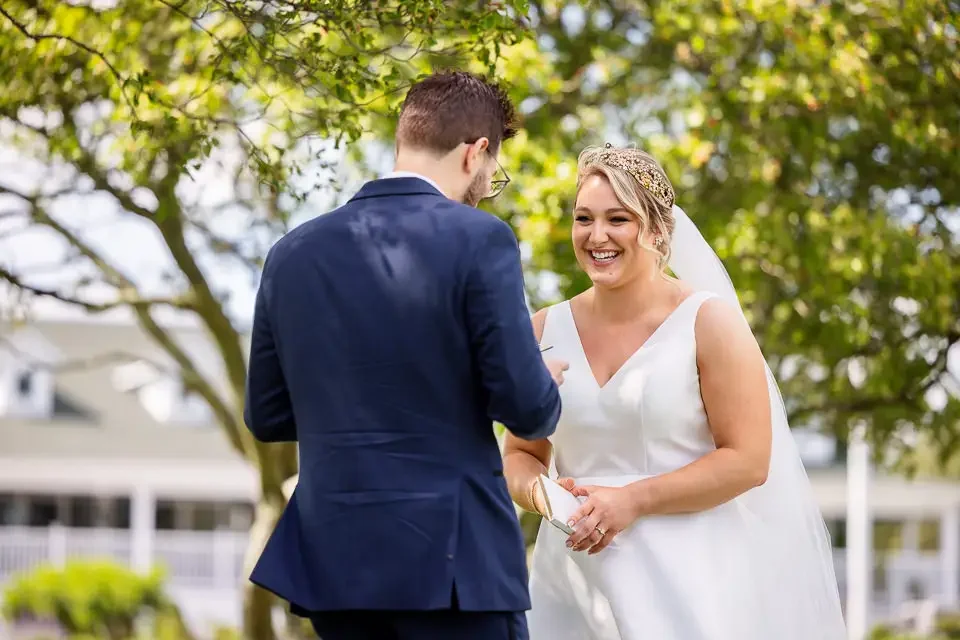 Joyful First Look Reaction Beneath the Trees