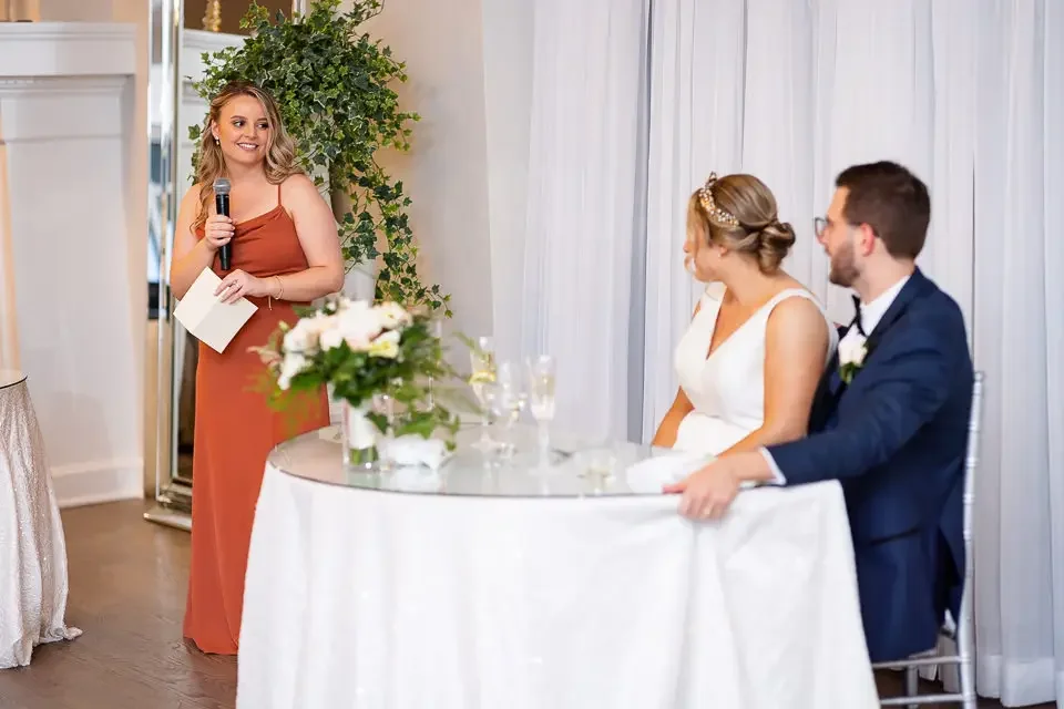 Bridesmaid giving a heartfelt wedding reception toast