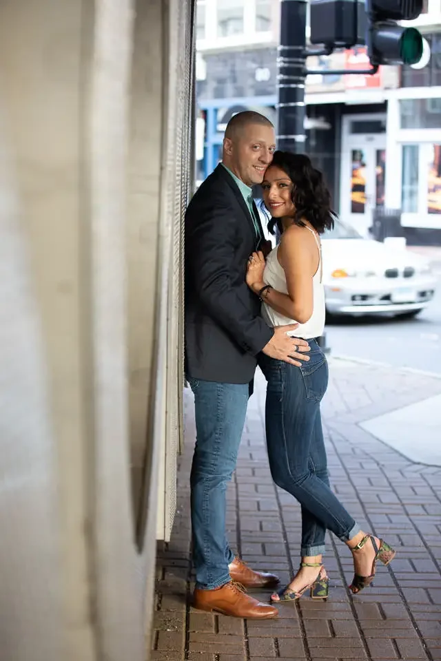 Couple Embracing During Urban Engagement Session