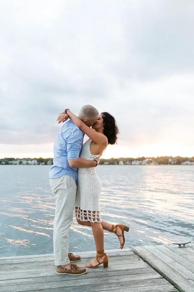 Sunset Dock Engagement Kiss