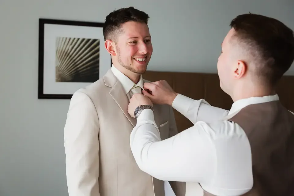 Groom Getting Ready with Groomsman