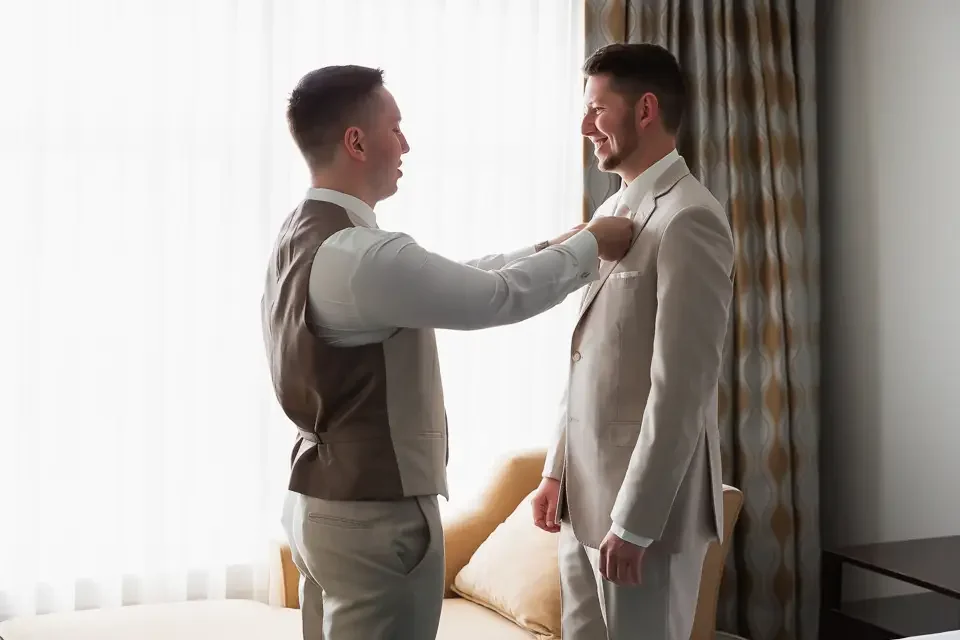 Groom Prep Window Light Moment