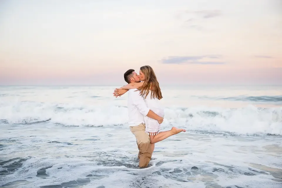 Sunset Embrace During a Romantic Beach Engagement Session