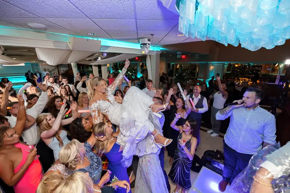 Bride Crowd Surfing at the Reception
