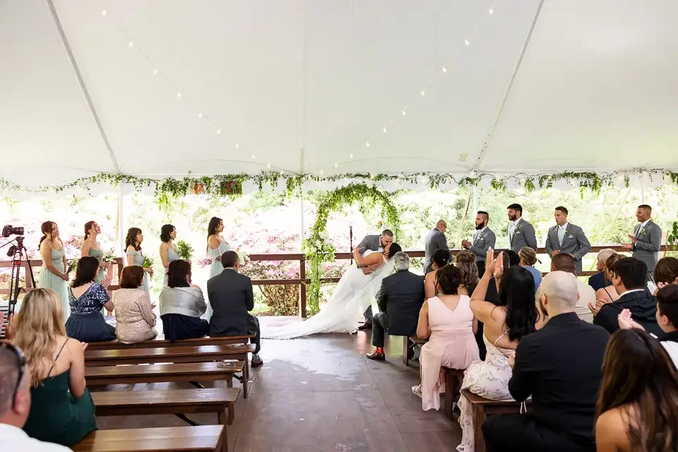 Outdoor Wedding Ceremony Kiss