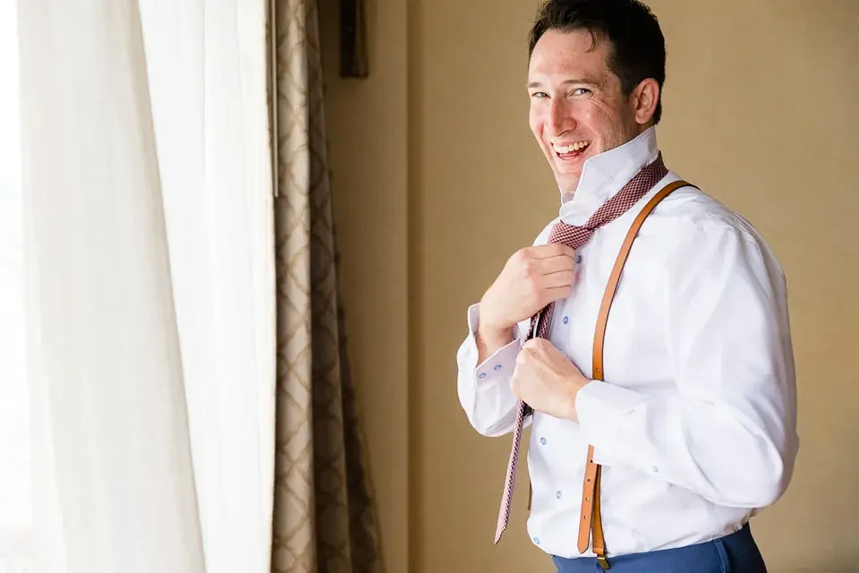 Groom Getting Ready With Natural Light