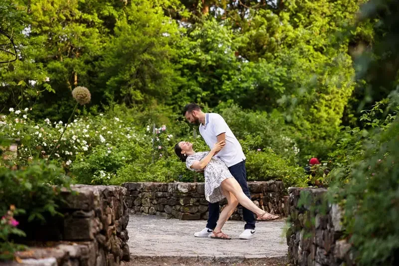 A Playful Dip Kiss in the Garden