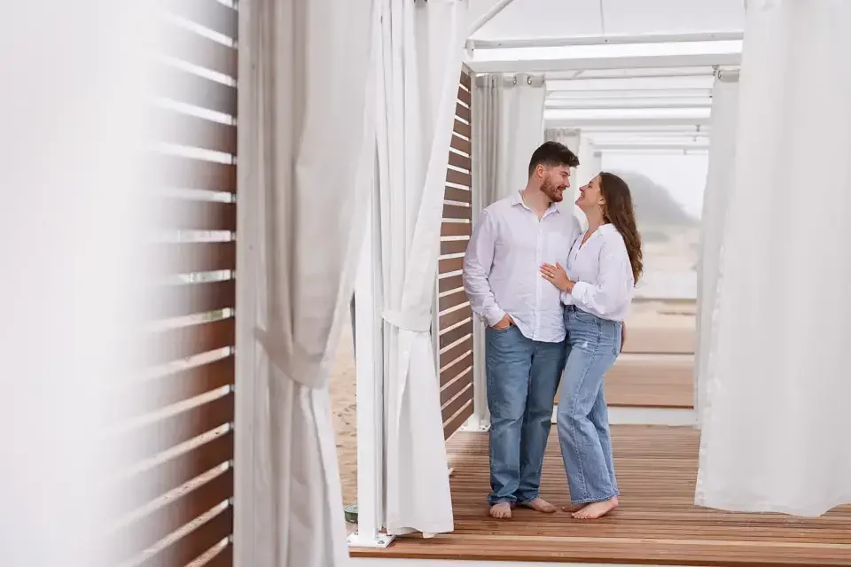 A couple on a covered beach location