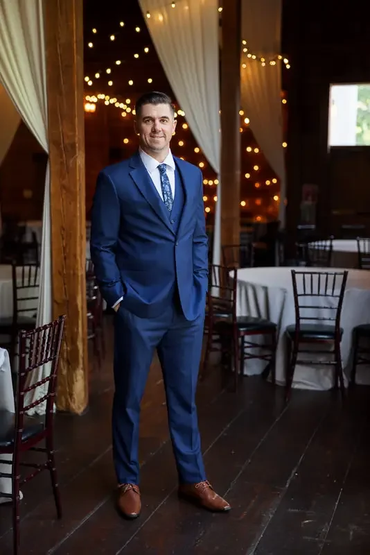 Groom Portrait in Barn Venue