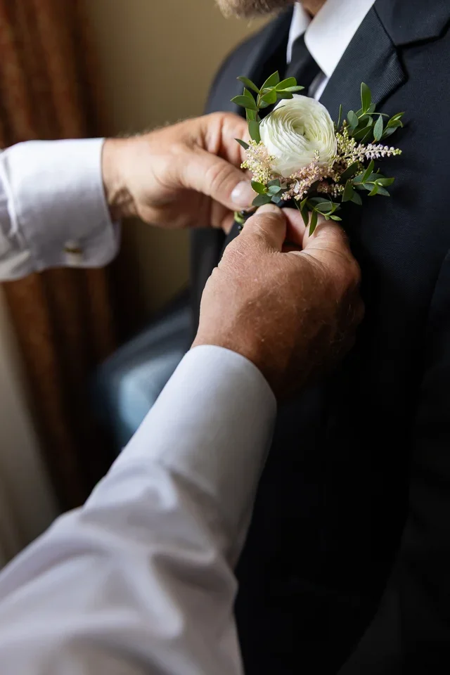 Pinning the Boutonniere