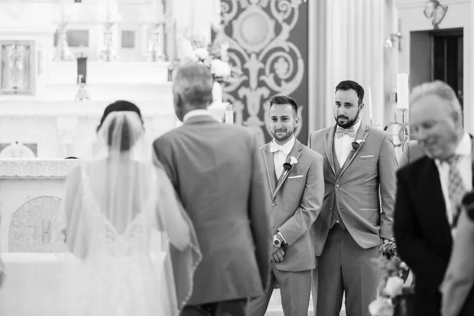 bride-veil-facing-away-suits-altar.jpg