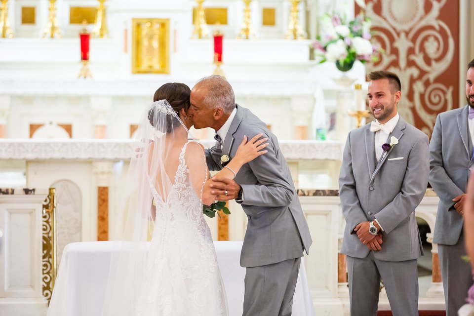 bride-white-lace-dress-veil-kissing.jpg