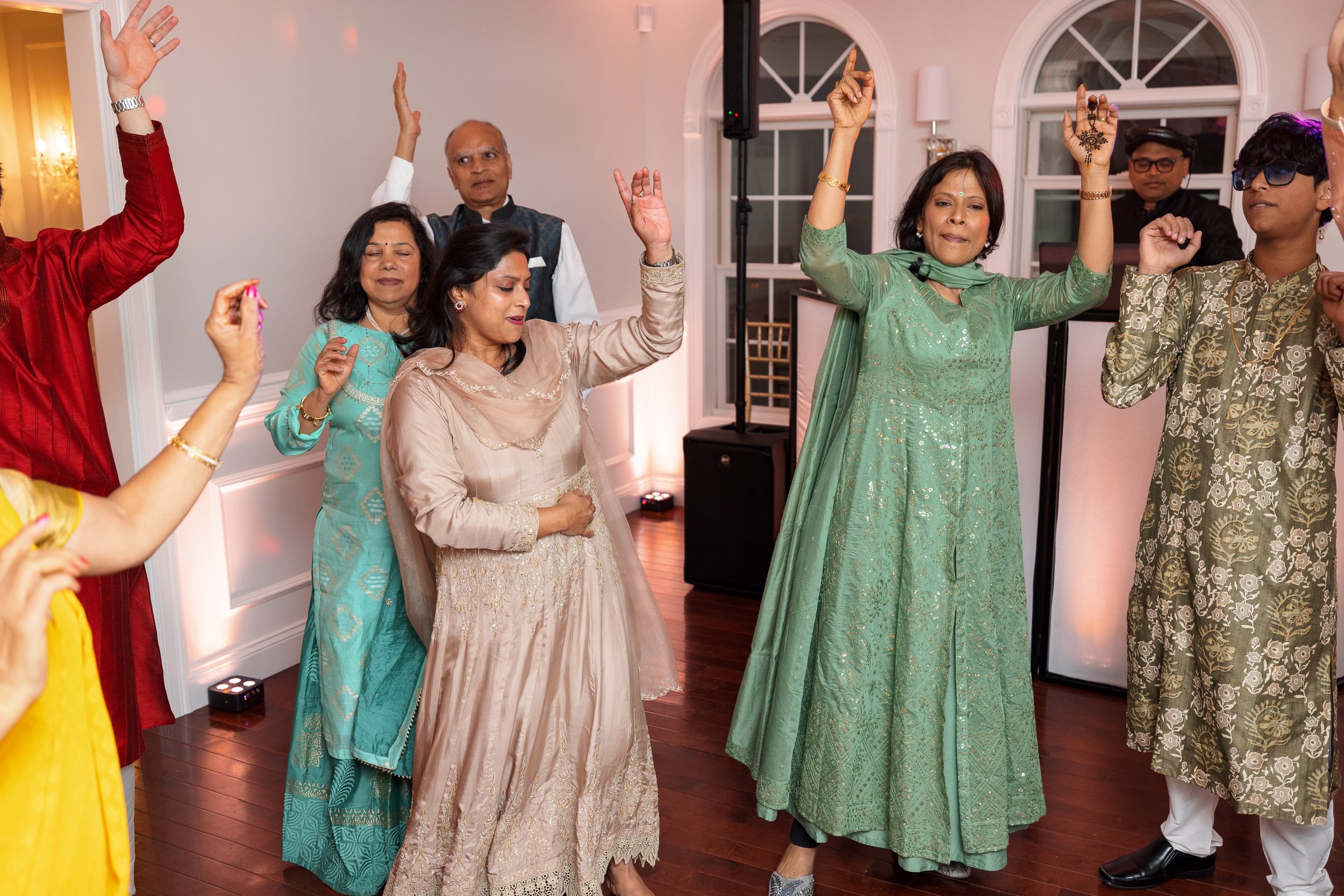 group-dancing-indoors-arms-raised.jpg