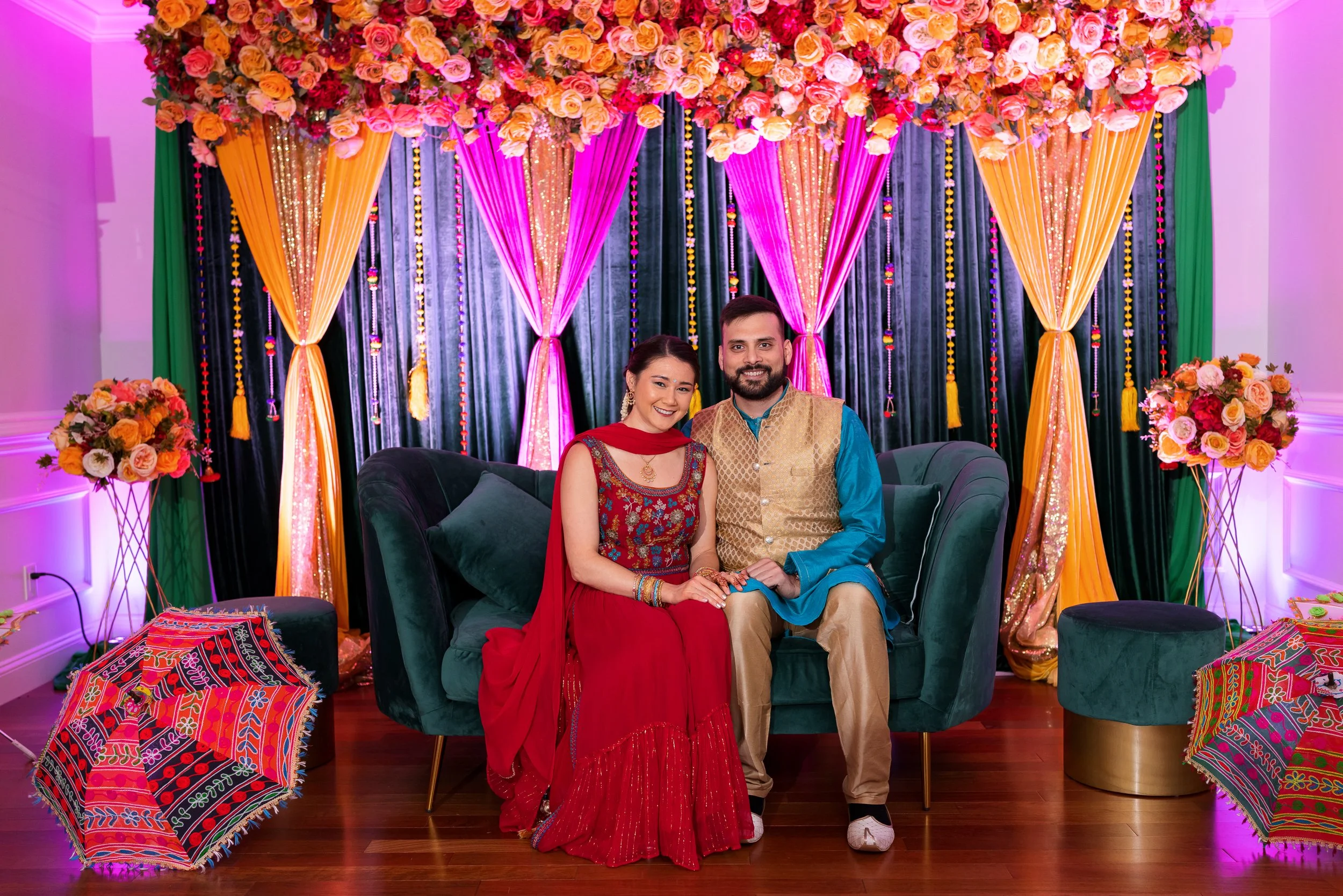 couple-seated-together-green-couch-floral.jpg