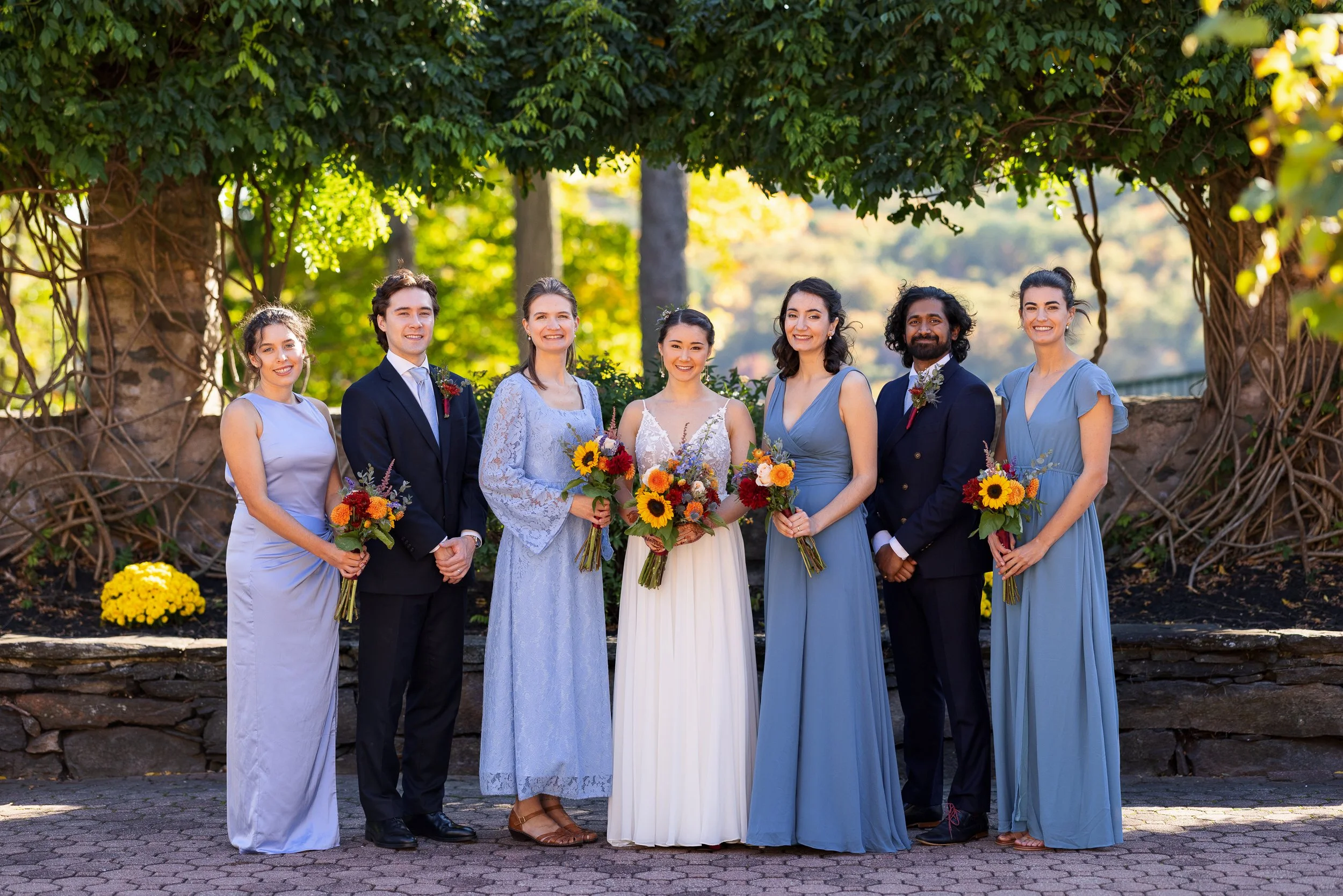 wedding-party-seven-standing-line-ivy.jpg
