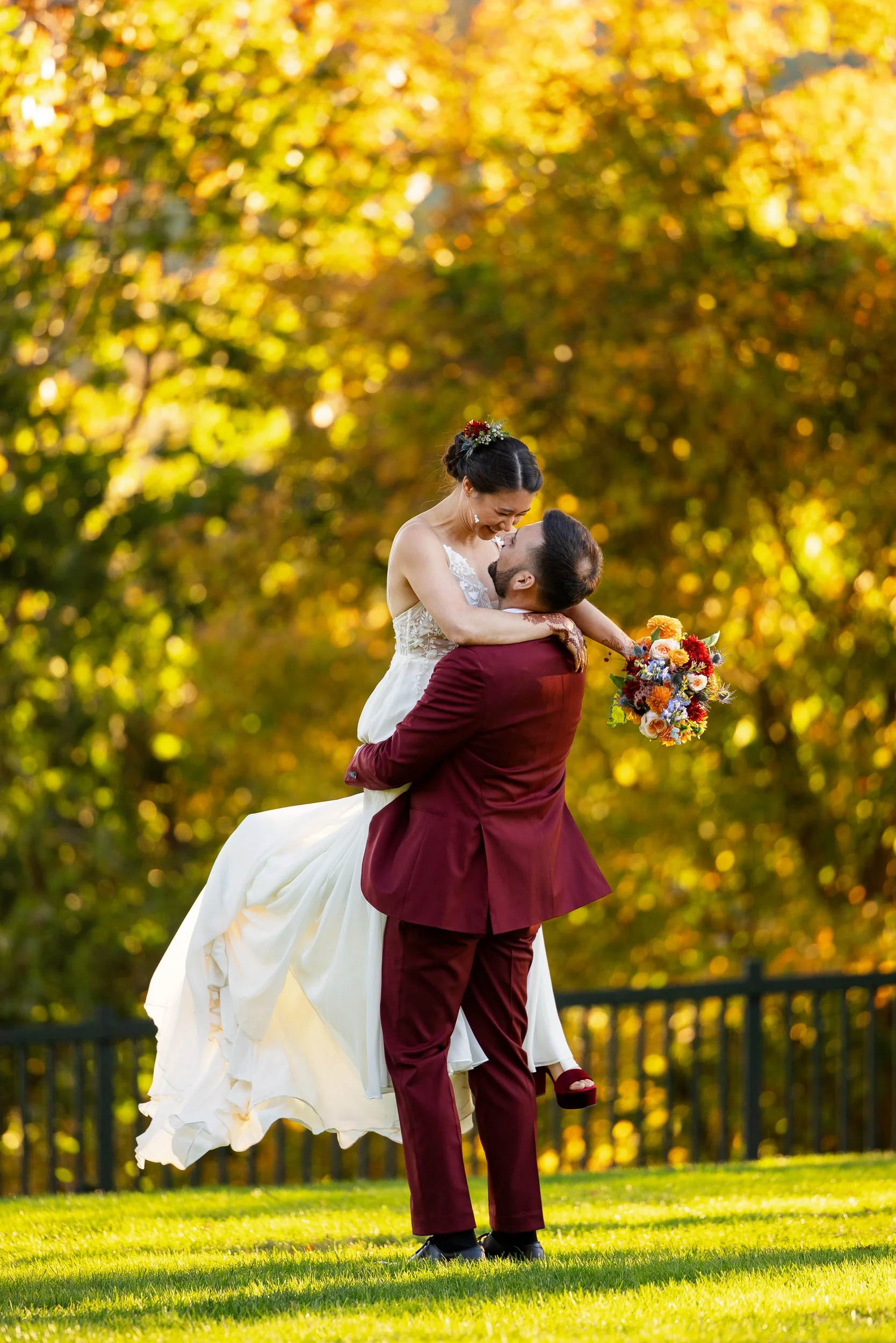 couple-wedding-attire-embracing-lawn-bright.jpg