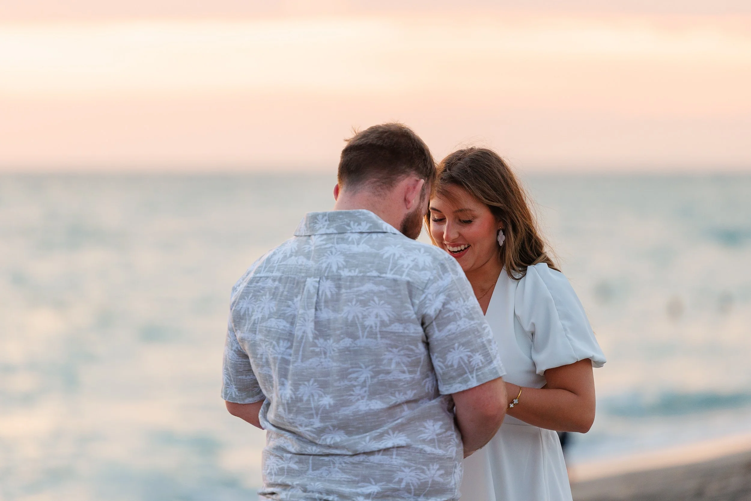 09-couple-facing-each-beach-sunset-smiling.jpg