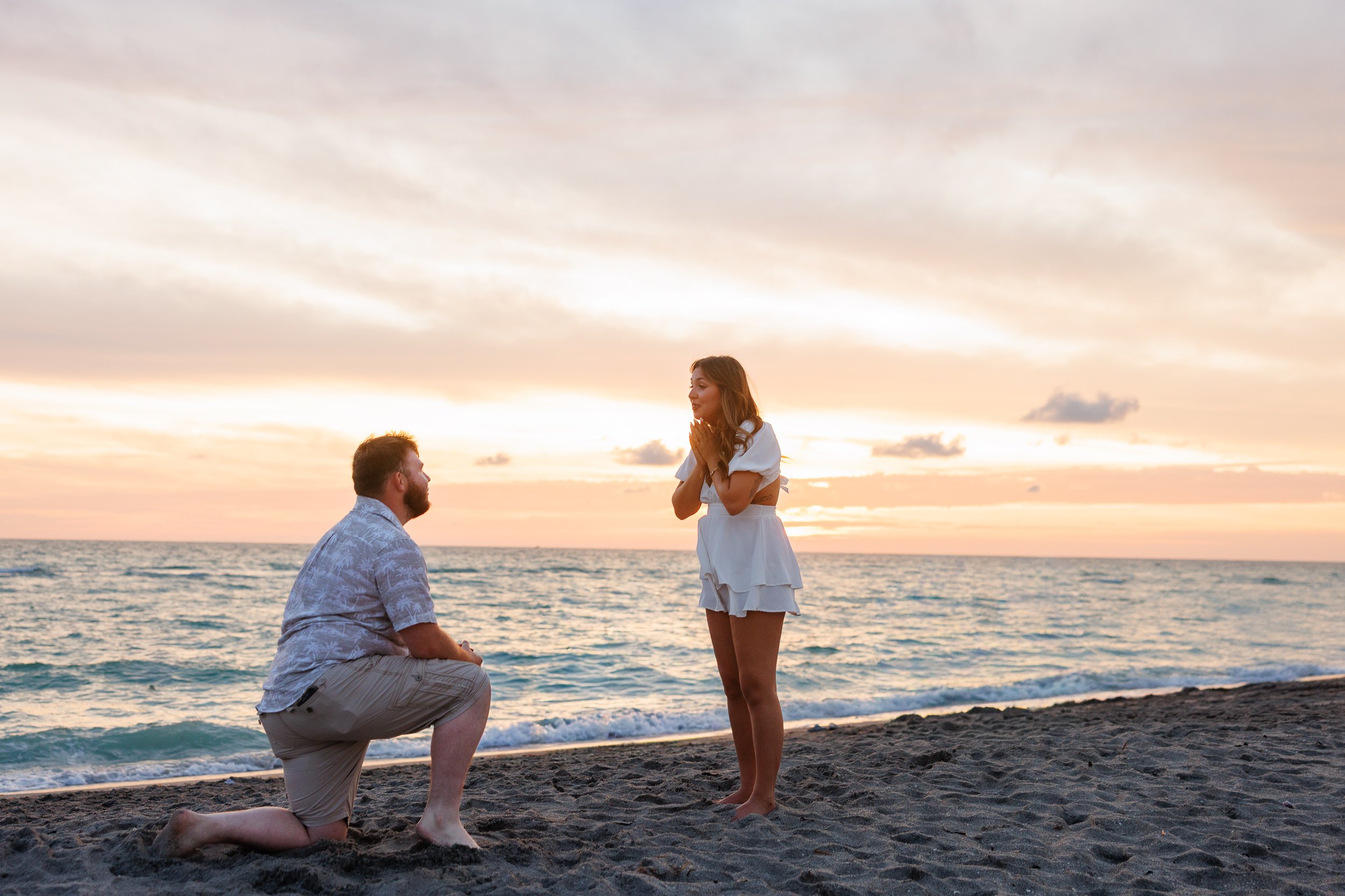08-kneeling-sand-facing-standing-beach-sunset.jpg