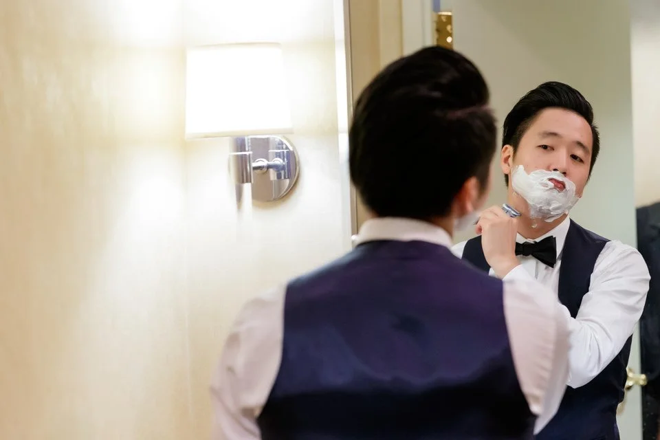 03-vest-bow-tie-shaving-bathroom-mirror.jpg