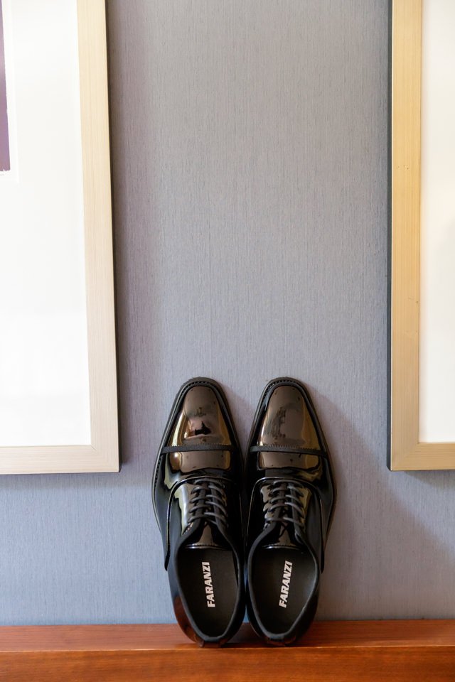 02-pair-black-dress-shoes-placed-wooden.jpg