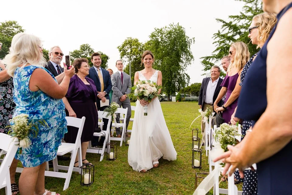 18-bride-white-dress-walking-aisle-lined.jpg
