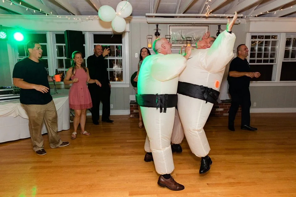 33-inflatable-sumo-costumes-dancing-wooden-floor.jpg