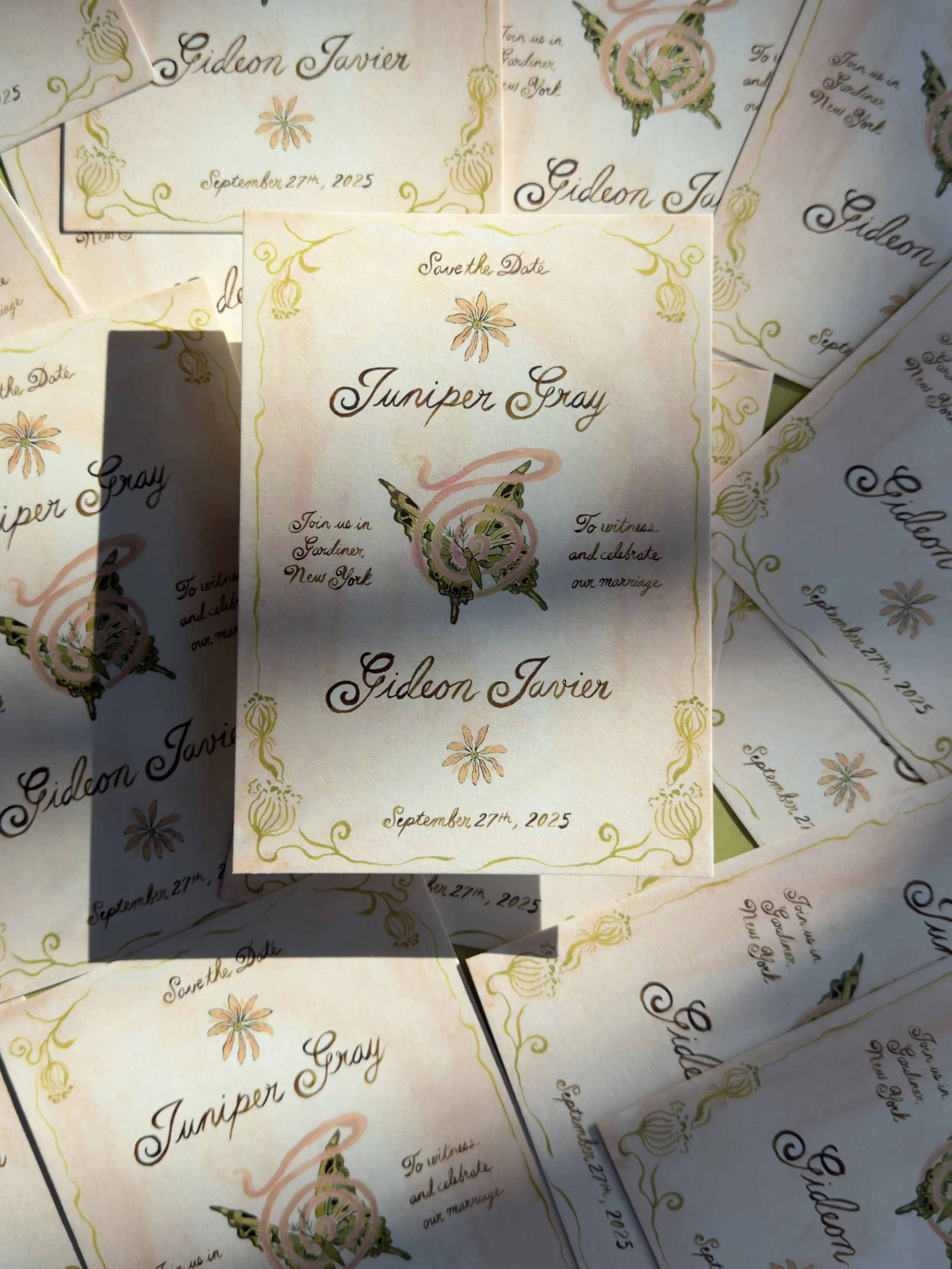 Multiple wedding save-the-date cards with floral and butterfly designs, featuring the names Gideon Javier and Juniper Gray, and the date September 27th, 2025.
