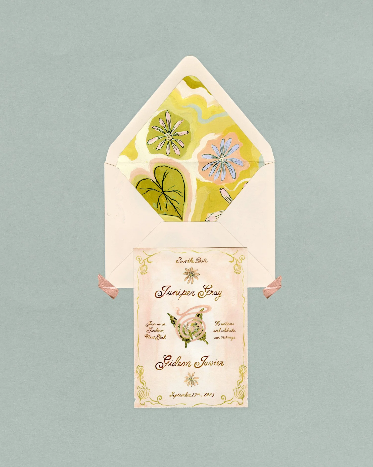 An elegant wedding invitation with a floral theme, featuring a white envelope with a colorful floral interior lining, and a matching invitation card with decorative text and illustrations of flowers and a dragon.