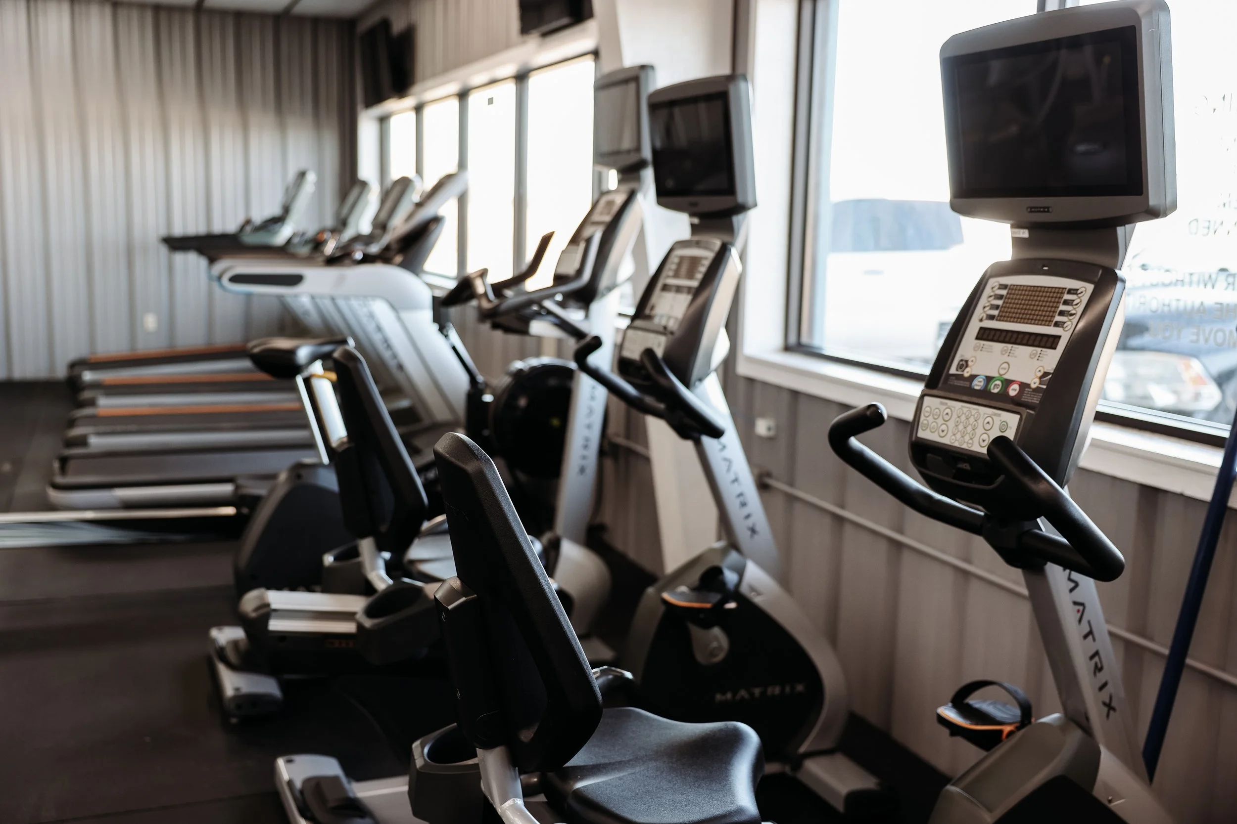Cardio machines including treadmills, ellipticals, and bikes at our 24 hour gym in Bonham TX