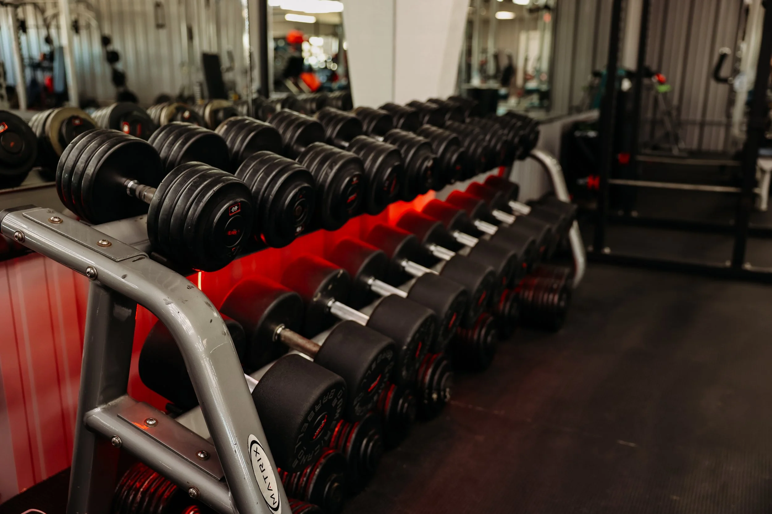 We have multiple racks of dumbbells for your workout.