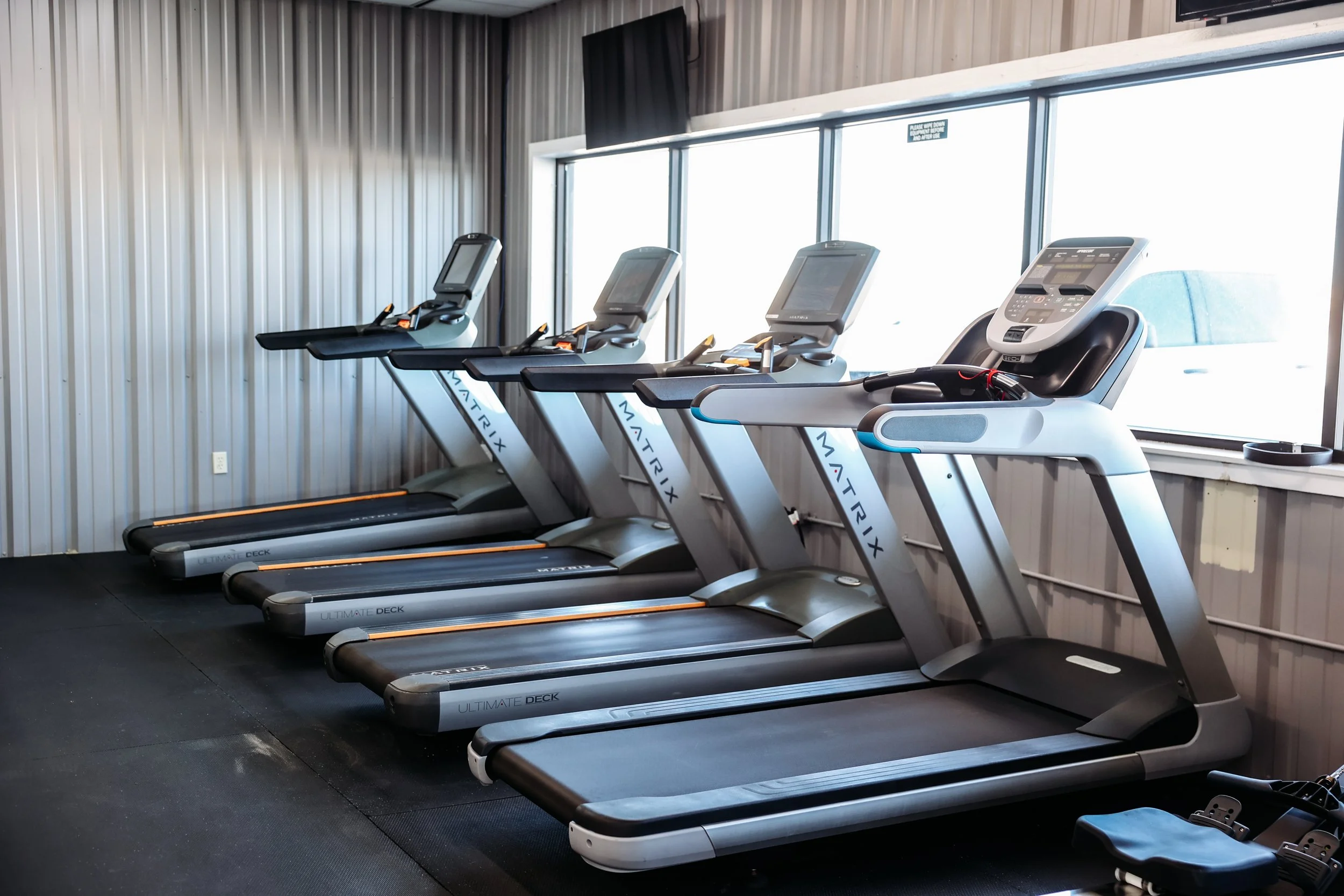 Cardio machines including treadmills and ellipticals at our Bonham Texas gym.