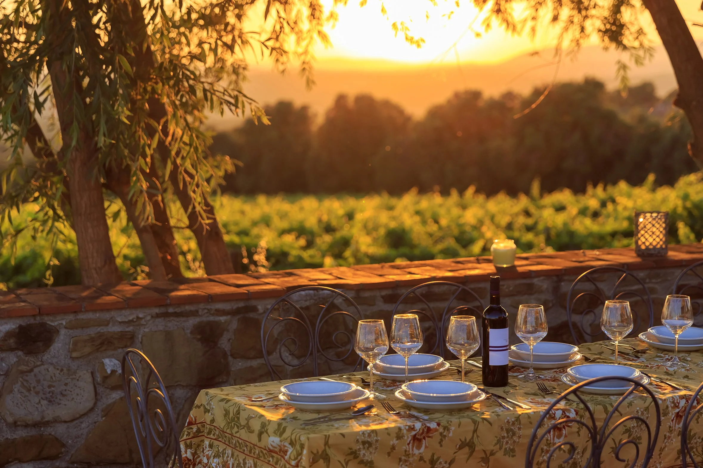 Al fresco dining in Tuscany at sunset on a small group women's Italian escape