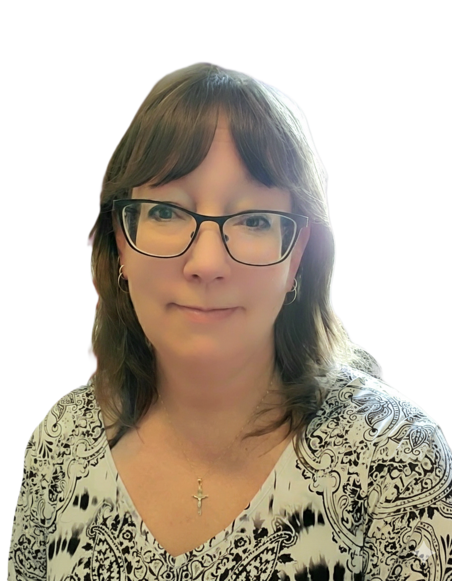 A woman with shoulder-length brown hair, wearing glasses, a patterned blouse, a gold necklace with a cross pendant, smiling slightly.