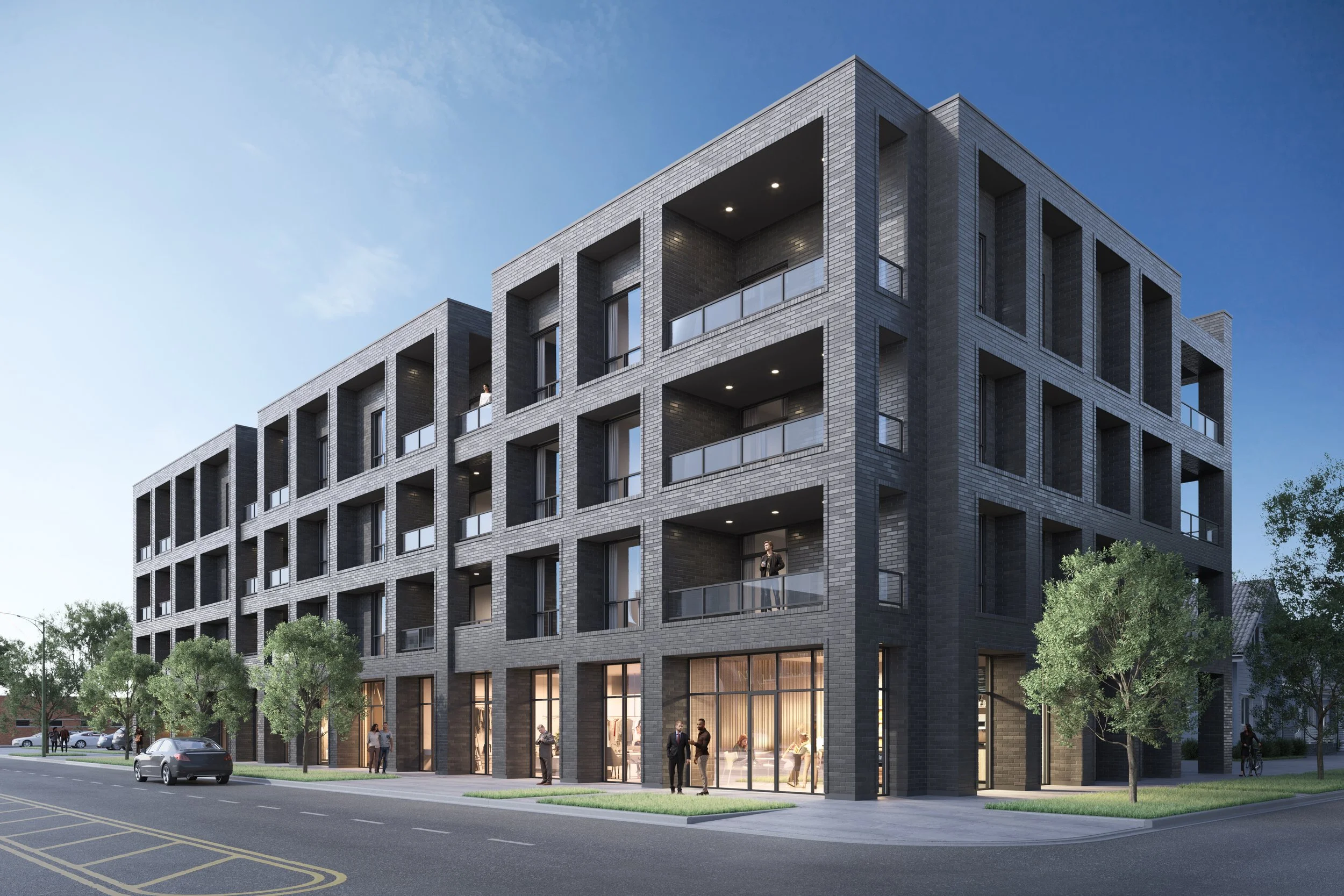 Modern five-story apartment building with brick exterior, glass balconies, and ground-floor retail space, surrounded by trees and a city street.