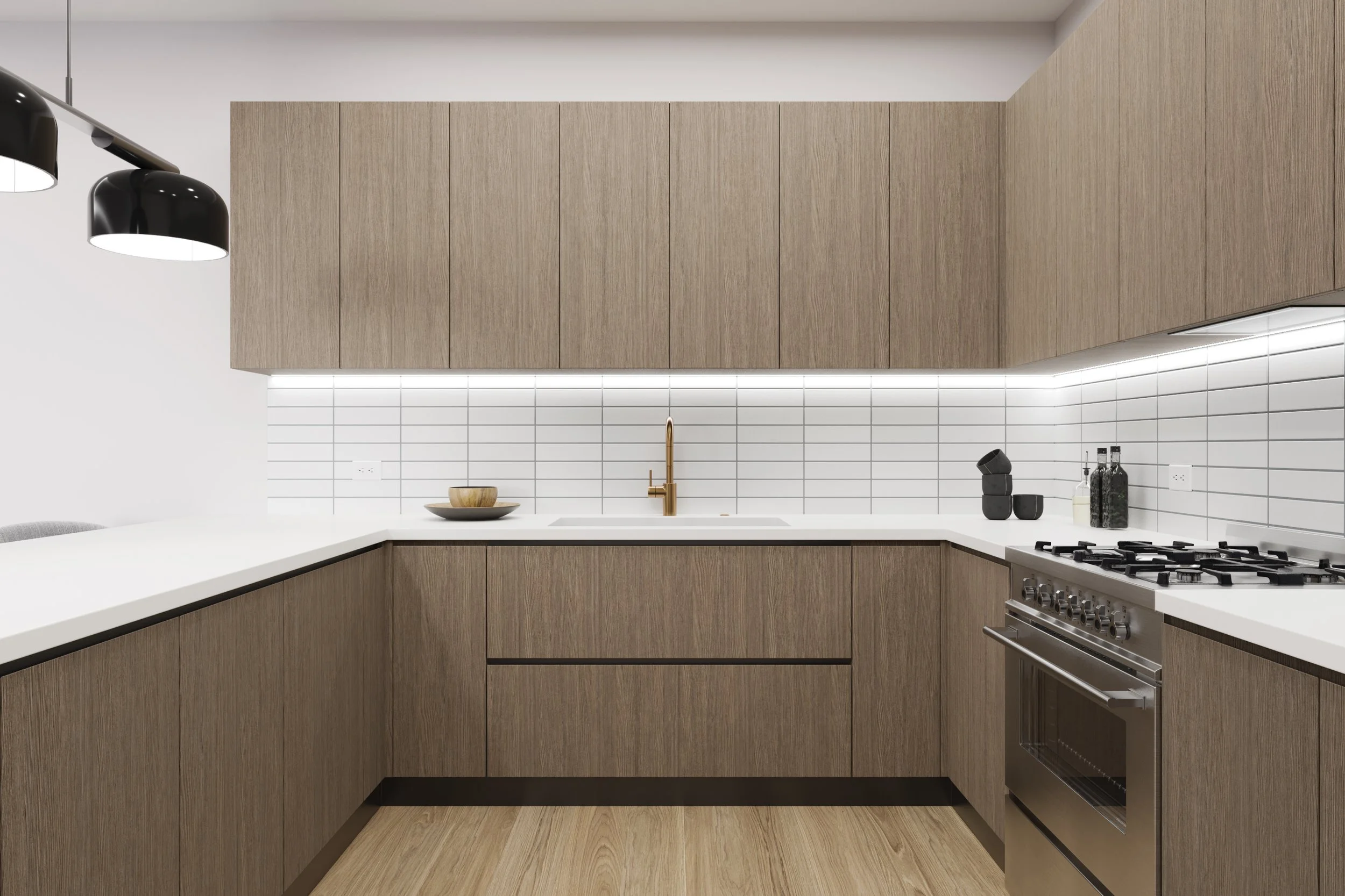 Modern kitchen with wood cabinets, white countertops, white tile backsplash, black pendant lights, and stainless steel oven