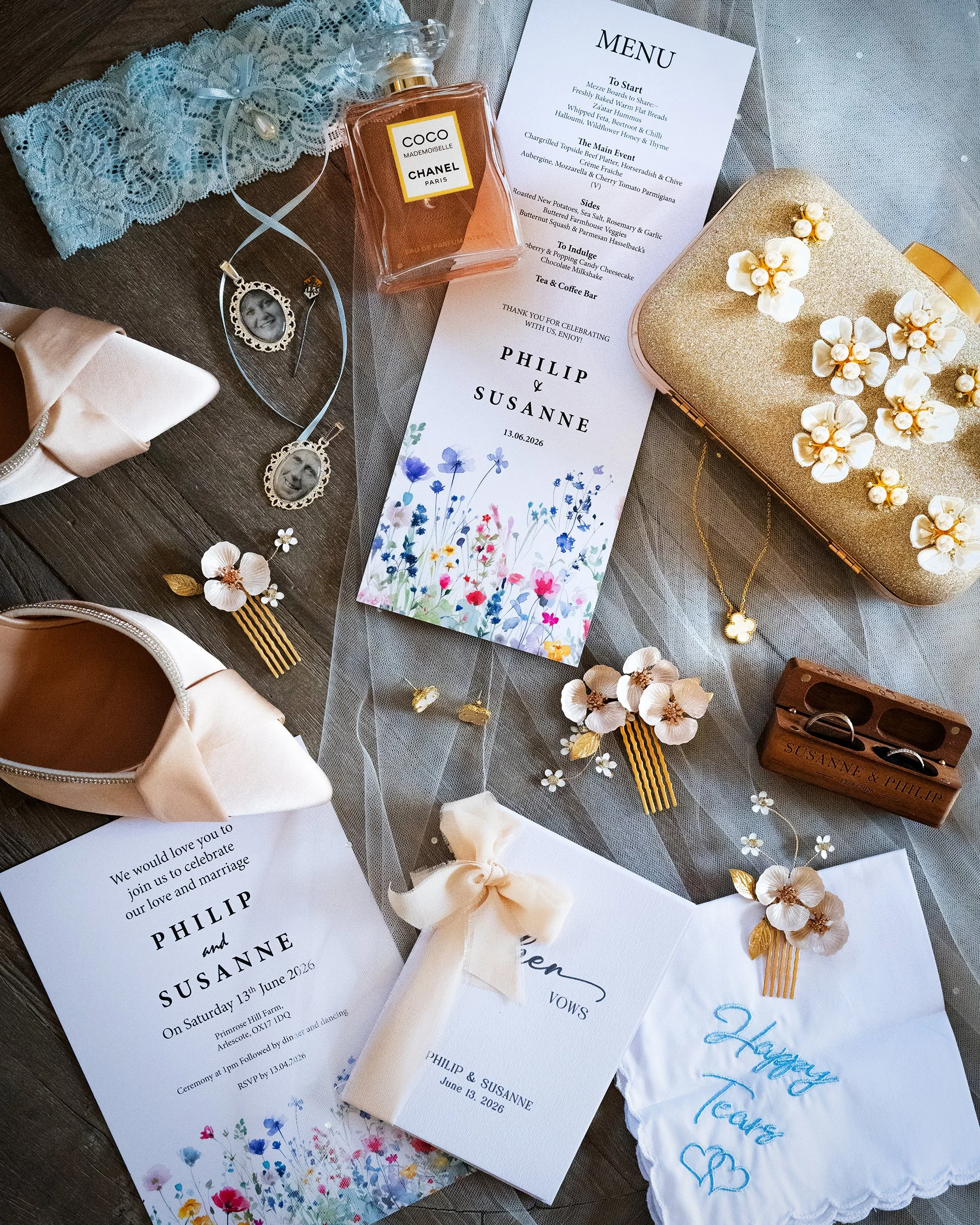 Bridal details as a wedding flatlay. Bridal shoes, perfume, staintionary, perfume, rings.