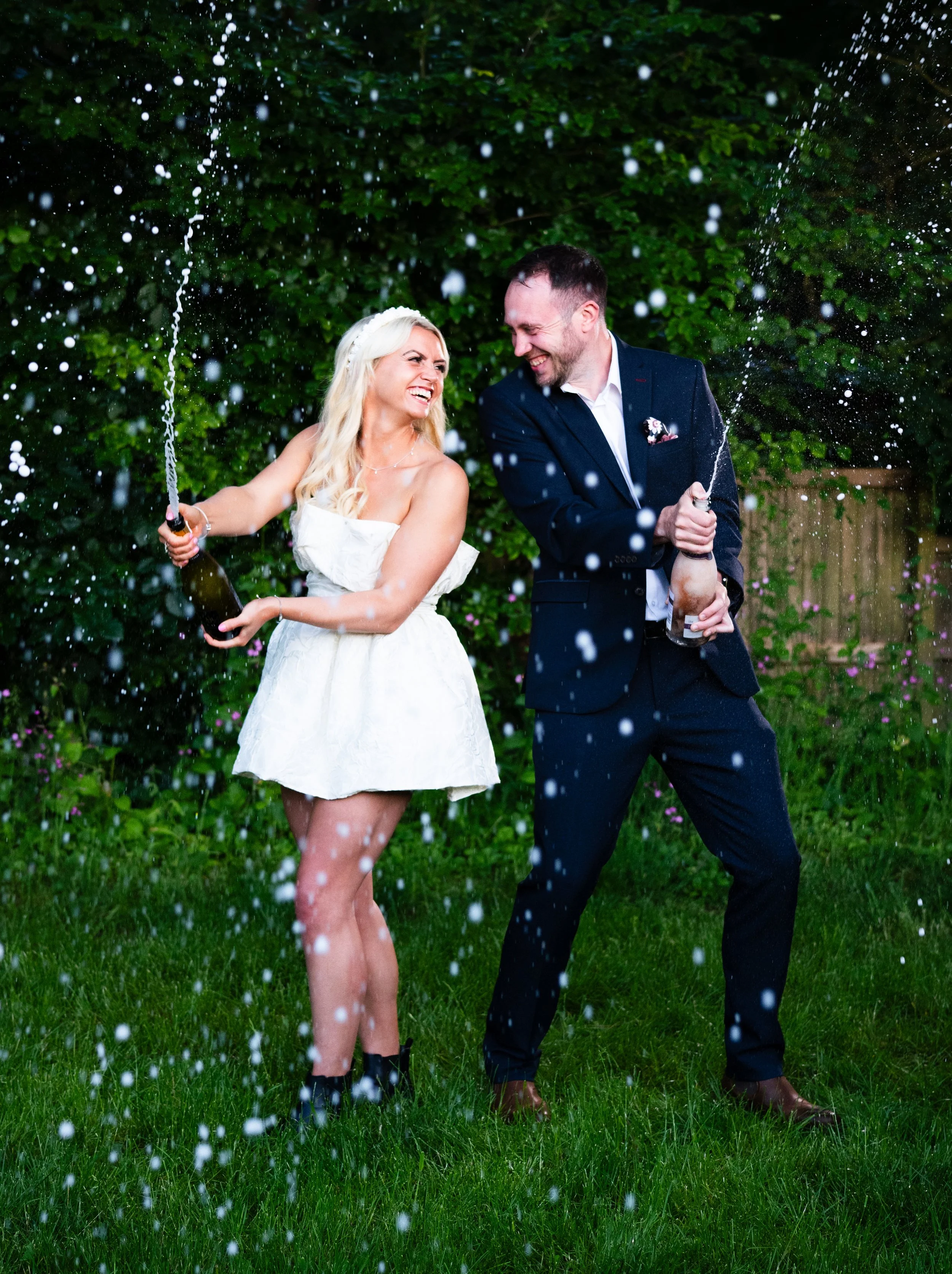 Prosecco Spray shot with wedding couple