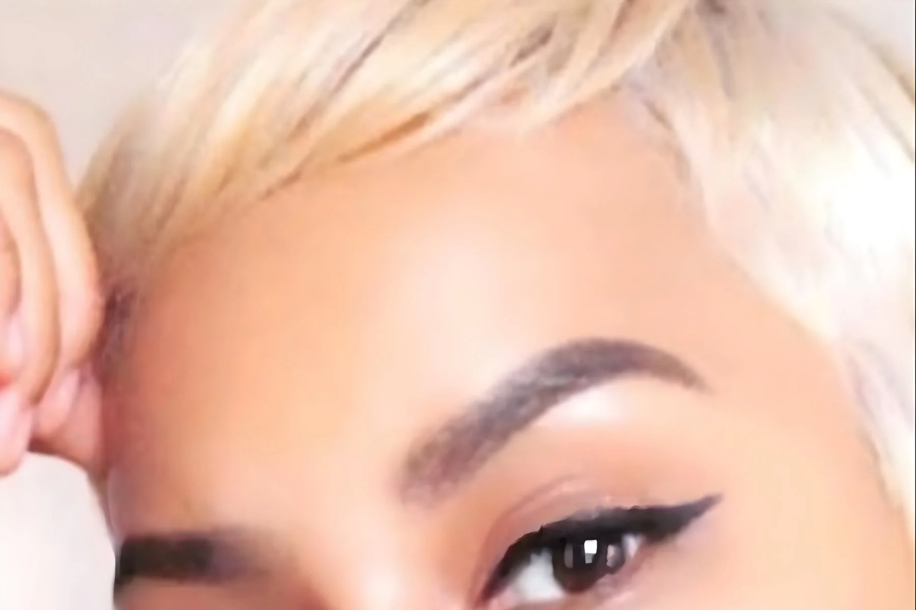 Double process color result at Willow's Cove Salon in Mineola NY — short platinum blonde pixie cut with bright, clean lift