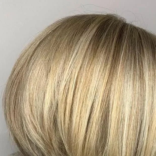 Full highlights result at Willow's Cove Salon in Mineola NY — short blonde bob with foiled brightness and multi-tonal dimension throughout