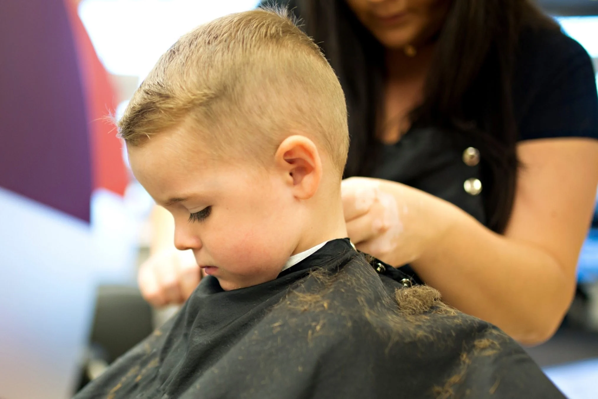 Single process color result at Willow's Cove Salon in Mineola NY — medium length wavy hair with warm copper tone and even, refreshed color
