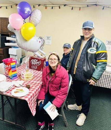 Hope Outreach celebrates employee Olivia Hagedon's 21st birthday. Also pictured are employee Pastor Jamie Weakly and Neill Wilbanks.
