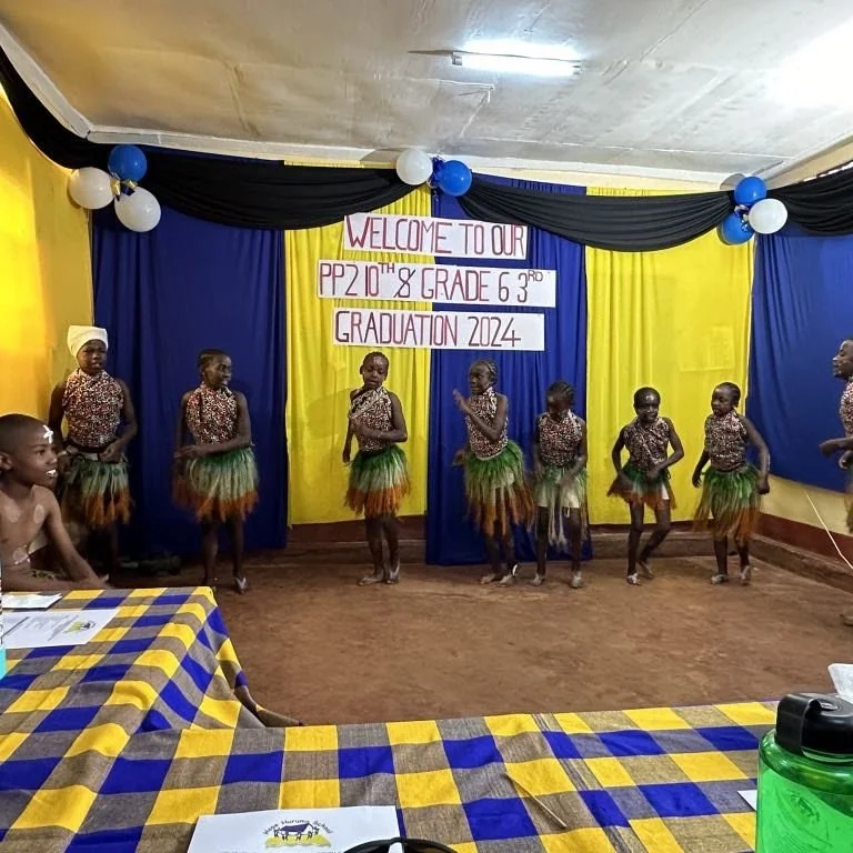 Children dressed in traditional attire performing a dance on stage during a graduation event for PP 2 and Grade 6 3.0, 2024.