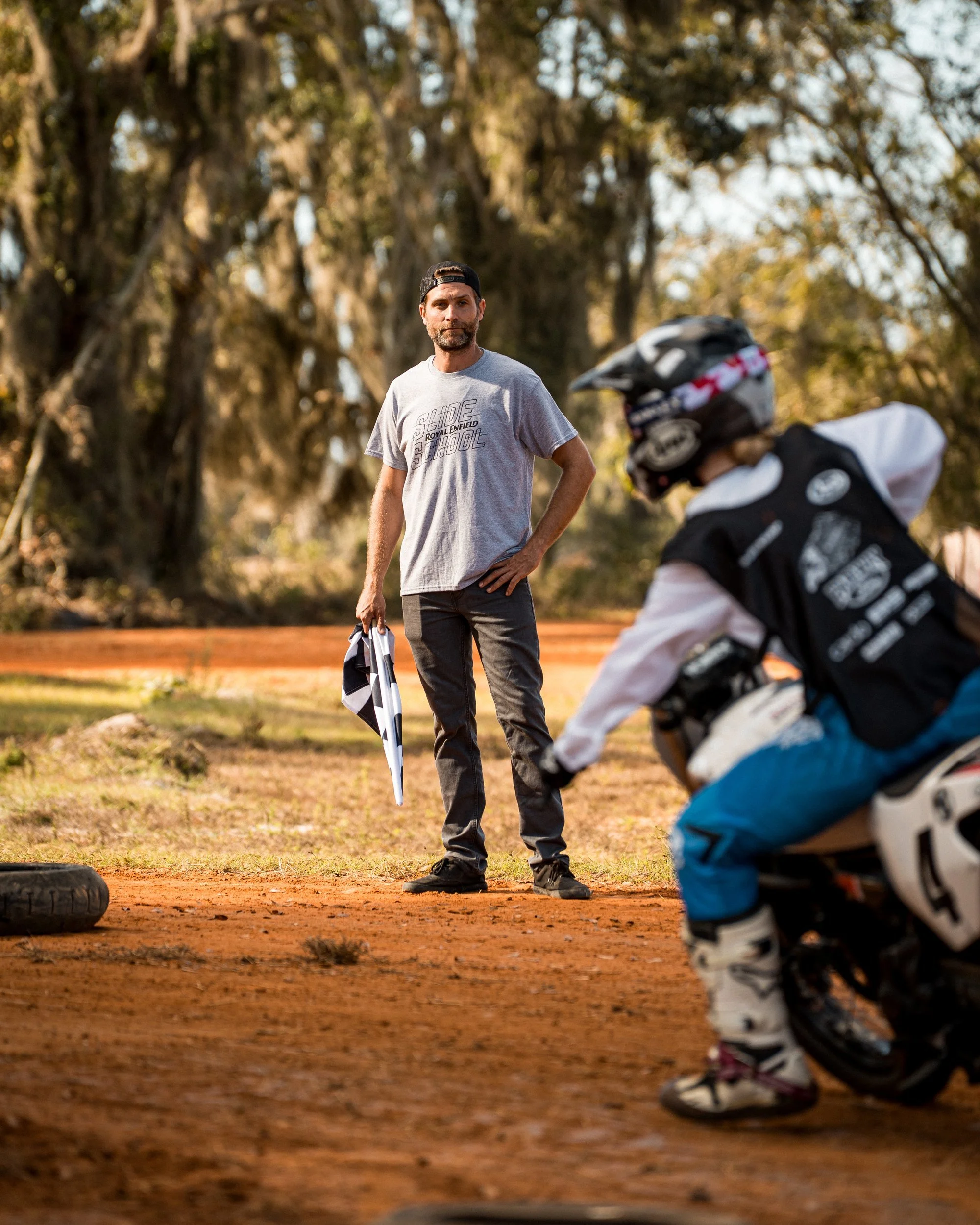 Instructor coaching a rider at Royal Enfield Slide School