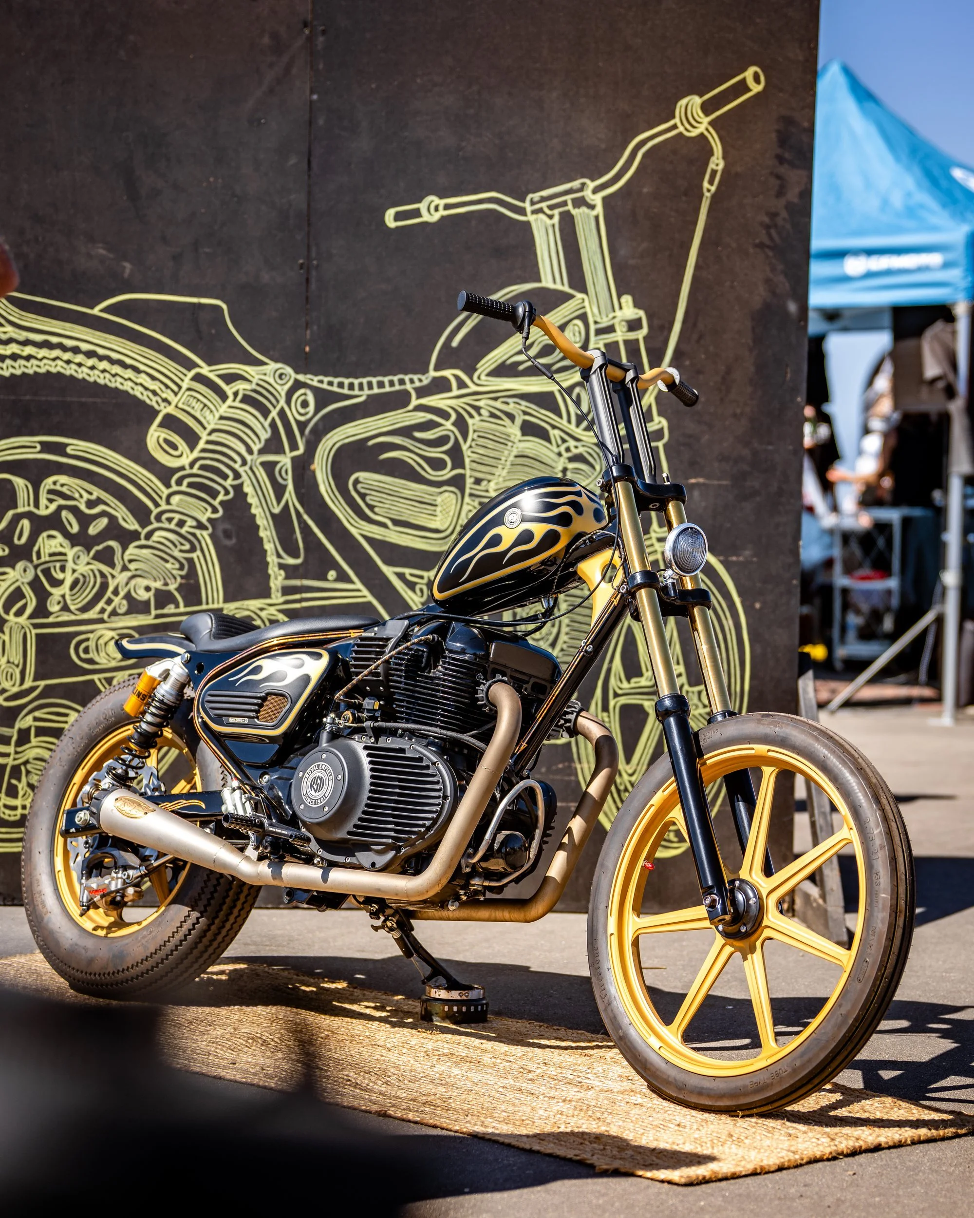 Gold-trimmed custom Royal Enfield on display at the Moto Beach Classic