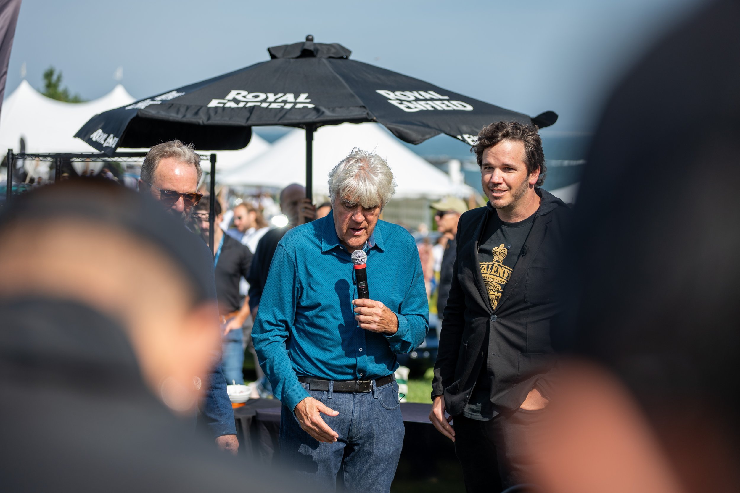 Jay Leno talking with guests at the Royal Enfield tent at Audrain