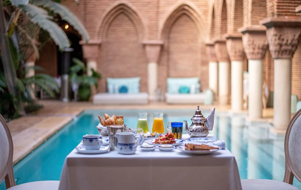 La Sultana breakfast by the pool riad courtyard Marrakech Morocco luxury hotel
