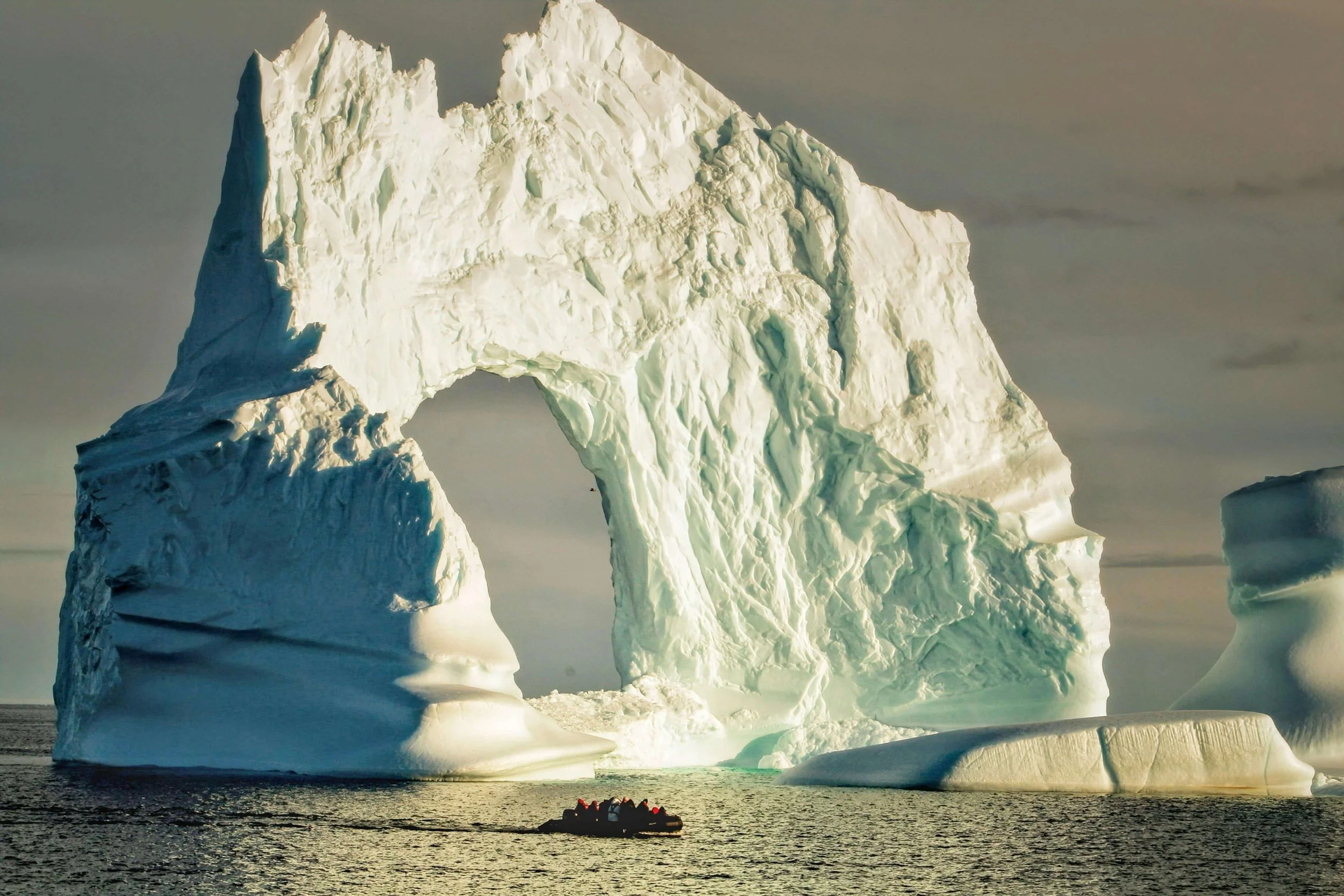 Antarctica expedition ship navigating glaciers along the Antarctic Peninsula.
